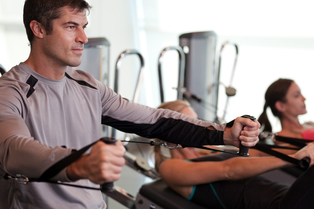 People working out on a cruise gym